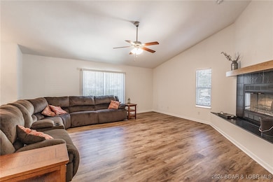 Upstairs living area with wood burning fireplace.