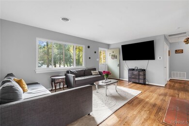 Living room featuring hardwood / wood-style floori
