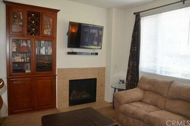 Family room with built in center and fireplace.
