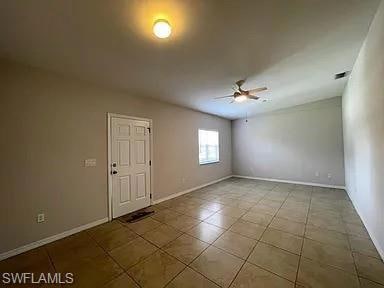 Spare room featuring tile patterned flooring, base
