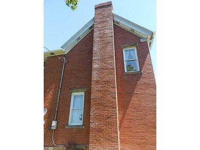 Exterior Front. Newer chimney
