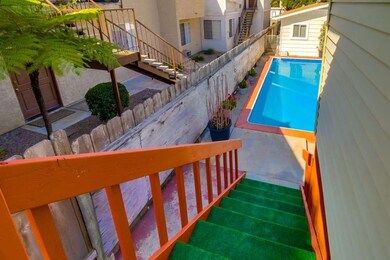 Stairs to backyard from front house.
