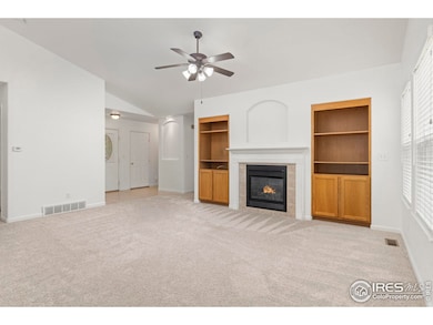 Living room with gas fireplace and built-ins