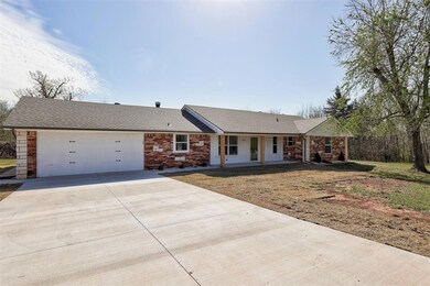 Ranch-style home featuring brick siding, driveway,