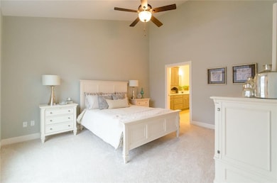 Master bedroom with cathedral ceiling.