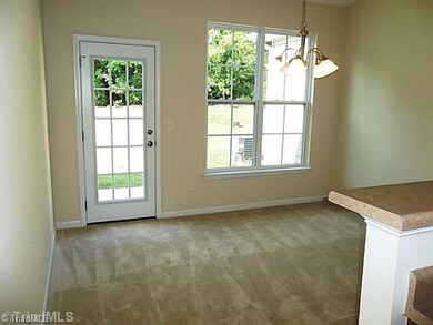 Dining Room. Large dining room has a dramatic cathedral ceiling, designer lighting and lots of natural light.