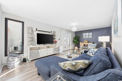 Living room featuring light hardwood / wood-style 
