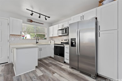 Updated flooring, countertops, and cabinets. Newer