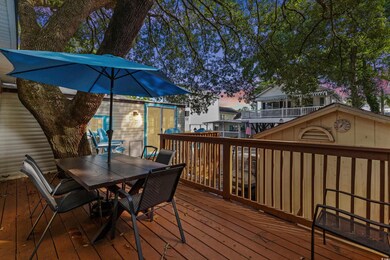 Deck at dusk featuring a storage shed