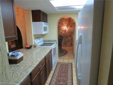 View of the kitchen leading to the dining area.
