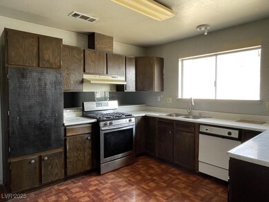 Kitchen with stainless steel gas range oven, dishw