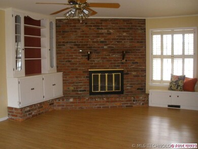 Family room with fireplace, built-ins and window s