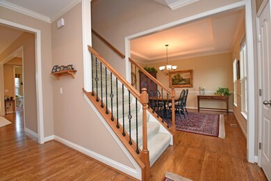 Entry features solid hardwood floors and open flow