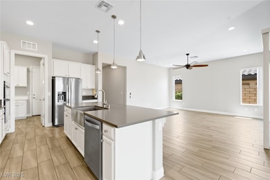 Kitchen featuring appliances with stainless steel