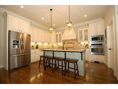 Kitchen. Stainless appliances, granite countertops and a huge pantry complete this warm and inviting kitchen.