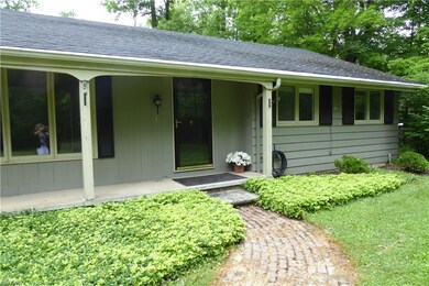 Walk up to the covered front porch on the quaint r