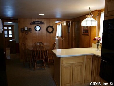 Kitchen. Open to the kitchen is a convenient eatin