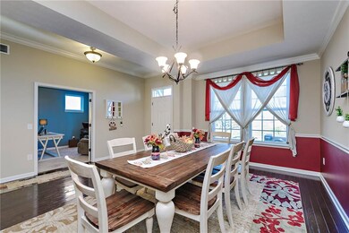 Another view of the welcoming foyer with office and formal dining. 