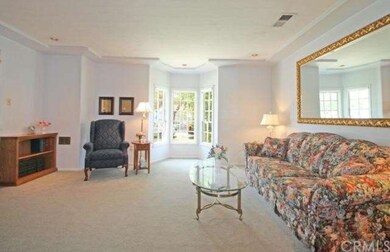 Formal Living Room with bay window is off the entr
