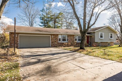 Tree-lined double-wide driveway