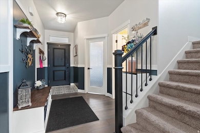 Entryway featuring light wood-style flooring and stairway