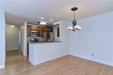 Hallway to two bedrooms, full bath and laundry roo