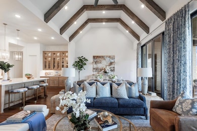Living area with a chandelier, dark wood-style fl