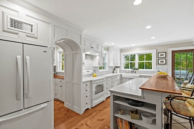 The kitchen offers carrara marble counters