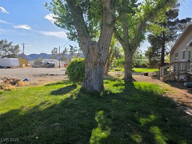 View of grassy yard with a mountain view