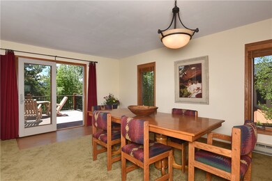Dining room opens to large lower deck with stunnin