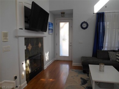 Fireplace with beautiful custom tile in living roo