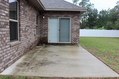 concrete patio in back yard