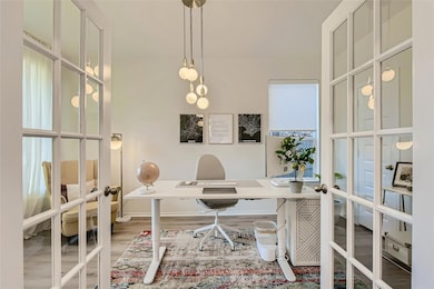 Office space with french doors and wood finished 