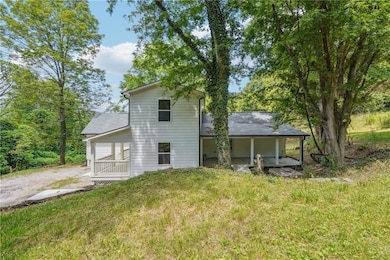 Rear view of house with a lawn