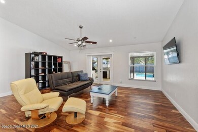 Open family room over looks pool
