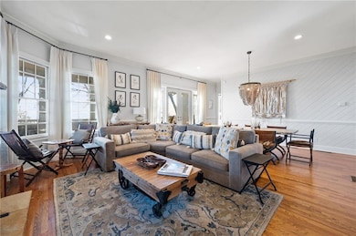 Living area with french doors, ornamental molding,