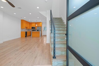 Stairway with recessed lighting, baseboards, visi