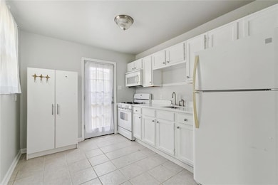Kitchen with door to exterior/back yard
