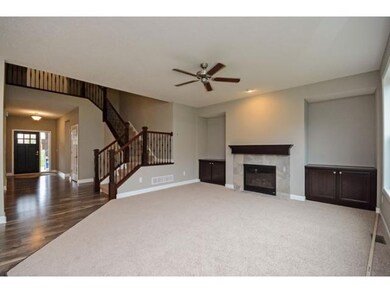 Great Room with 3 Large Windows, Centered Fireplac