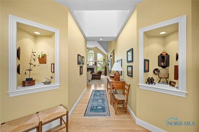 Skylit foyer is filled with natural light from abo