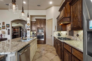 Kitchen with appliances with stainless steel finis