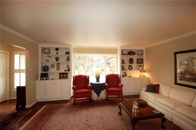 What a lovely space with pretty bow window, and bu