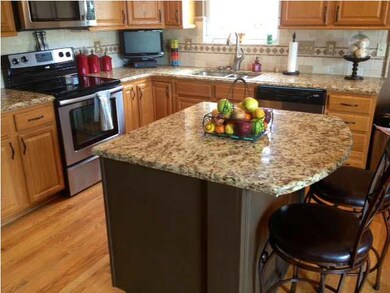 Stunning View of Kitchen Island with Granite throu
