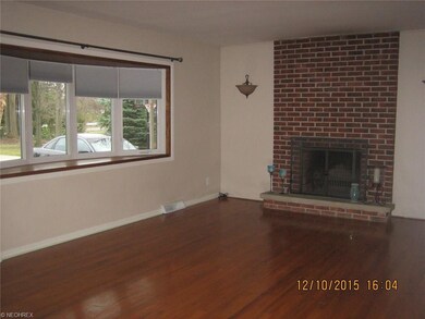 Spacious Living room with brick wall fireplace, an