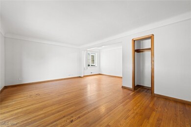 Living room with light hardwood / wood-style floors