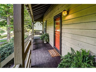 Full front porch with swing, perfect for a fall ev