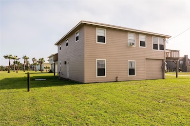 Rear view of house with a yard