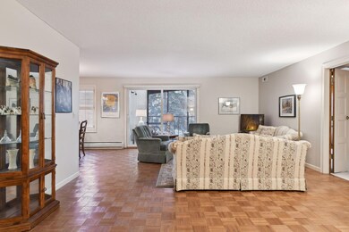 The foyer has wood parquet floor in great condition throughout the foyer, great room and the dining room.