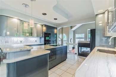 High end Jen Air double oven. Glass tile backsplas