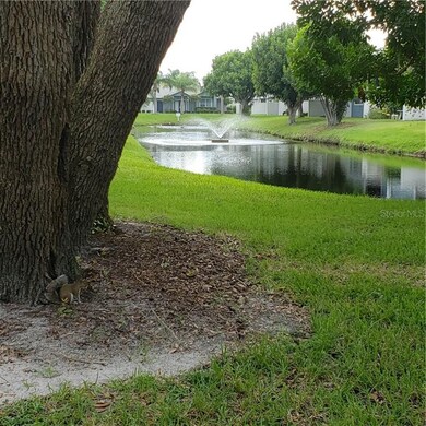 Gound level view of lake behind unit with beautifu
